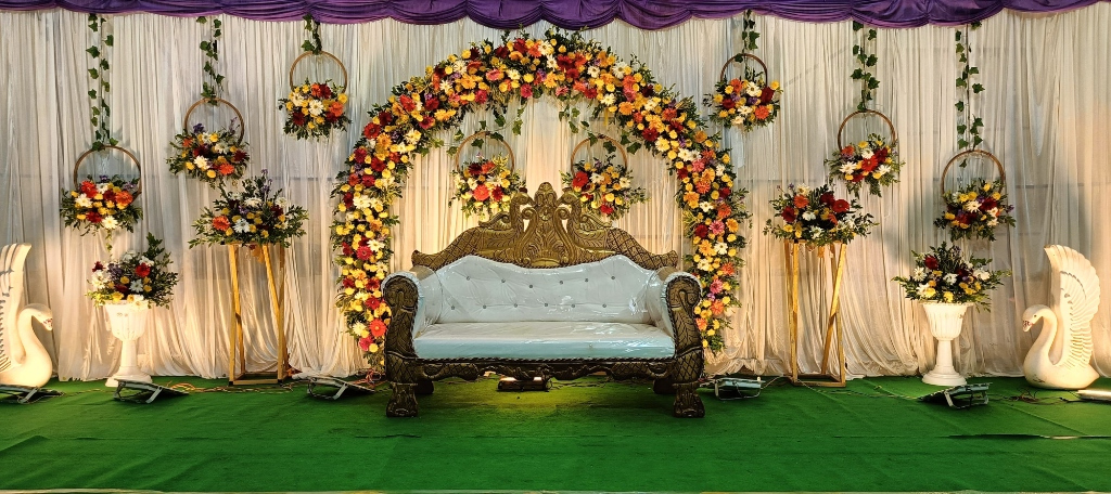 Circular Floral Arch Reception Stage with Royal Victorian Sofa