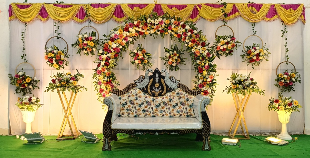 Round Floral Wreath Arch with Royal Peacock Settee & Gold Pedestals
