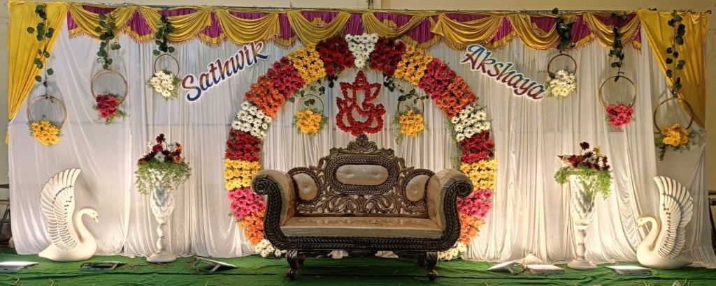 Name-Themed Floral Backdrop for Sathwik & Akshaya Ceremony with Swan Motifs