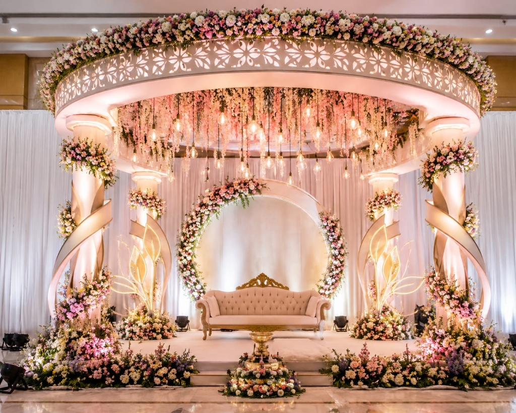 Blush Rose Dome & Warm Edison Light Reception Stage with Illuminated Leaf Pillars & Royal Sofa